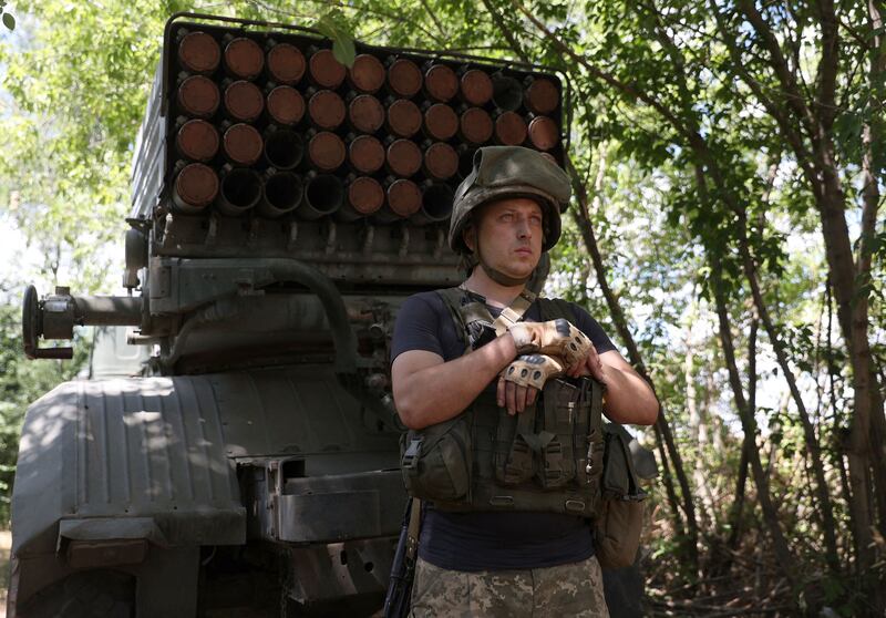 A Ukrainian serviceman stands next to a Grad BM-21 multiple rocket launcher at the front line in Donbas, eastern Ukraine. AFP