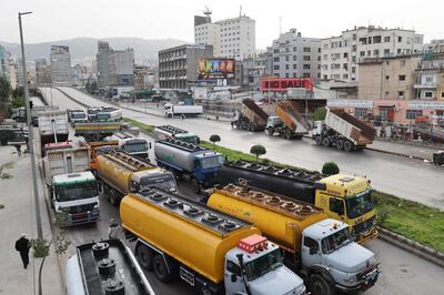 Fuel tankers block a road in Beirut last month during a general strike by public transport and workers unions over the country's economic crisis. AFP