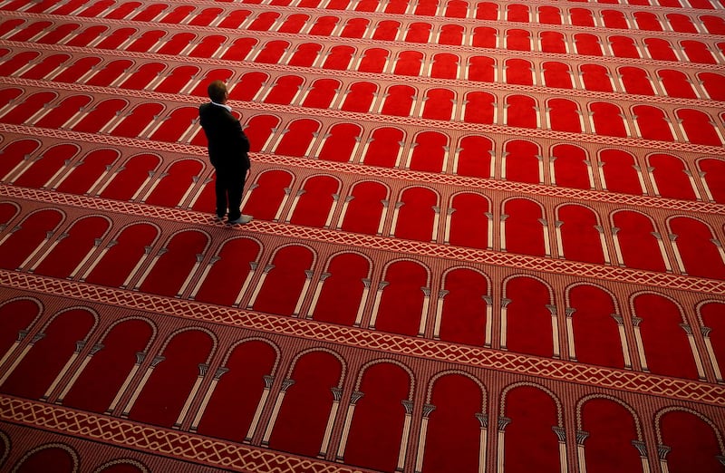 A man is pictured inside the closed Great Mosque of Brussels during the first day of Ramadan amid the coronavirus disease (COVID-19) outbreak, Belgium April 24, 2020. REUTERS/Francois Lenoir     TPX IMAGES OF THE DAY