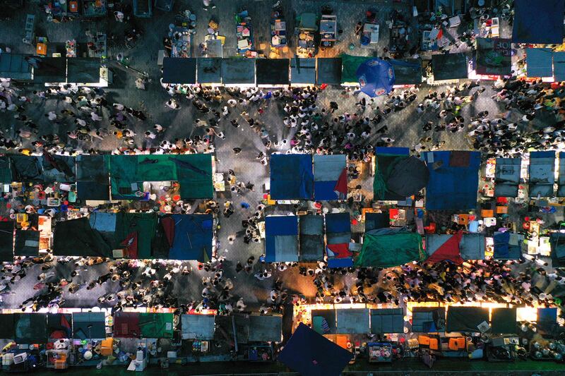People visiting a night market in Nanjing in China's eastern Jiangsu province. AFP