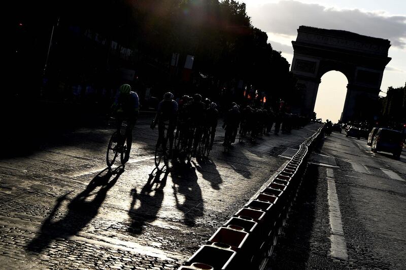 The peloton ride down the Champs Elysees in Paris on July 28, 2019. AFP