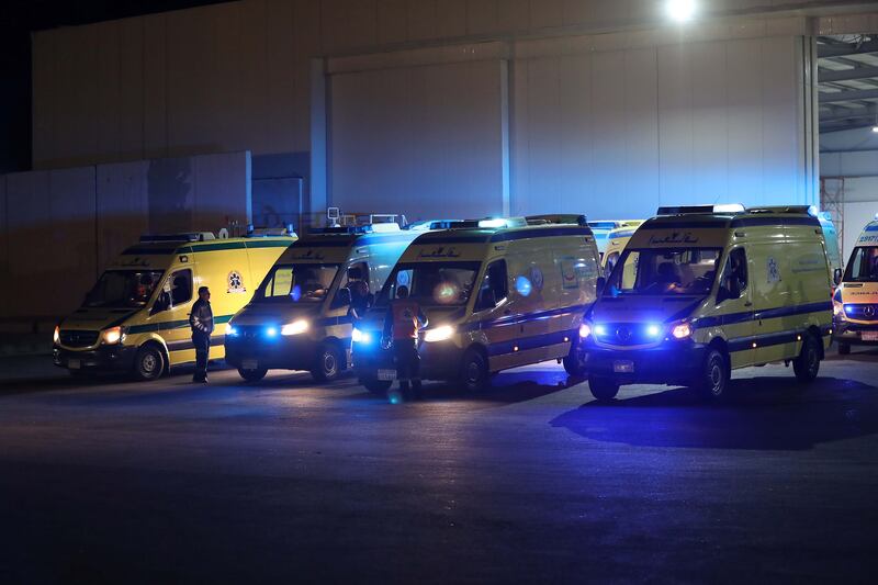 Ambulances bring injured Palestinians and cancer patients from Gaza to Al Arish airport in Egypt