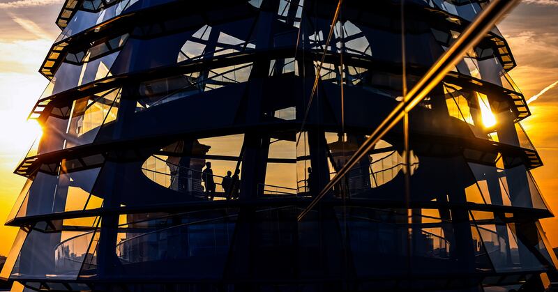 The sun sets behind the spiral ramp inside the dome of the Reichstag building in Berlin. EPA