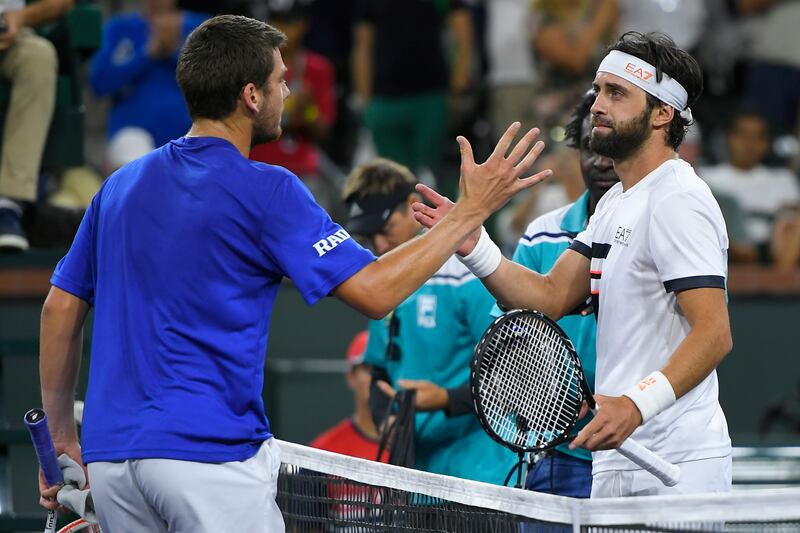 Cameron Norrie, left, of Britain, shakes hands with Nikoloz Basilashvili, of Georgia, after defeating him in the singles final at the BNP Paribas Open. AP Photo