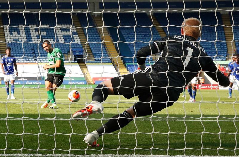 Leicester City goalkeeper Kasper Schmeichel saves a penalty hit by Brighton striker Neal Maupay. AFP