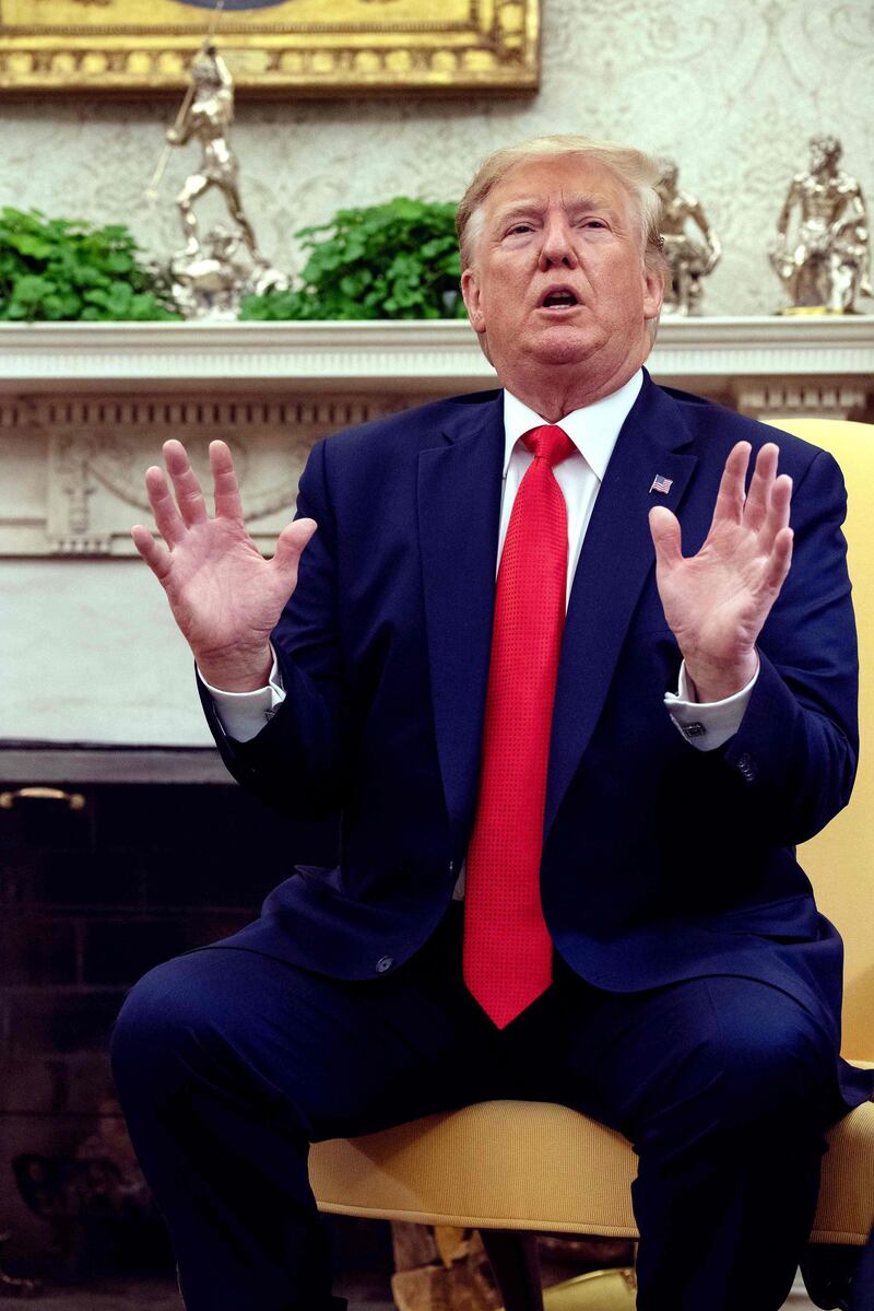 US President Donald Trump speaks to the press in the Oval Office at the White House in Washington, DC, on September 11, 2019. Trump on Wednesday announced his administration was considering a ban on flavored vaping products, amid a growing outbreak of severe lung disease in the US that has claimed at least six lives. "It's causing a lot of problems," the president told reporters at the White House, where he was accompanied by Health and Human Services Secretary Alex Azar and acting Food and Drug Administration head Norman Sharpless. / AFP / NICHOLAS KAMM
