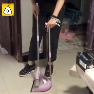 Lisa Li was later filmed sweeping up the mess in the apartment. Screengrab / Courtesy pearvideo.com 