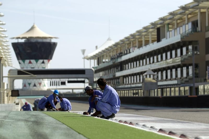 Gardeners work to maintain the landscaped areas lining the track. Courtesy Seven Media