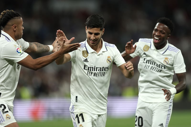 Marco Asensio celebrates with Vinicius Junior and Mariano Diaz after scoring for Real Madrid against Getafe. AFP