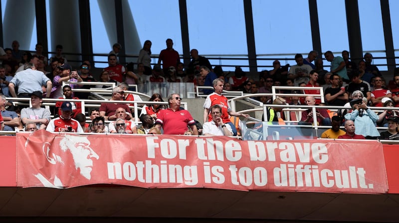 Arsenal fans display a banner in tribute to manager Arsene Wenger. Tony O'Brien / Action Images via Reuters