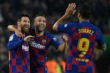 Barcelona's Argentine forward Lionel Messi (L) celebrates his goal with Barcelona's Spanish defender Jordi Alba and Barcelona's Uruguayan forward Luis Suarez during the Spanish league football match between FC Barcelona and Real Valladolid FC at the Camp Nou stadium in Barcelona on October 29, 2019. / AFP / LLUIS GENE