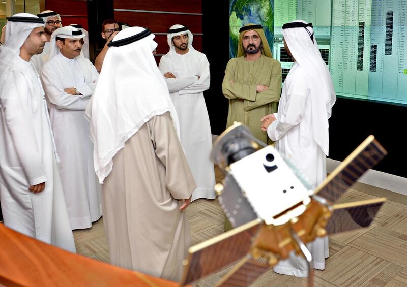Sheikh Mohammed bin Rashid, Vice President and Ruler of Dubai, at the launch of the building phase of the satellite, KhalifaSat, in 2013. Wam    