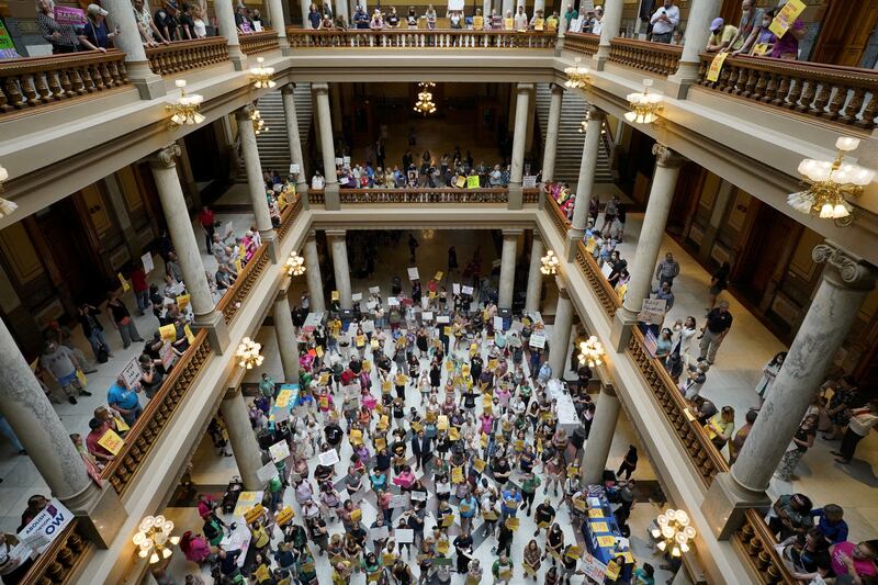 Activists protest in Indiana Statehouse during a special session debating the banning of abortion in Indianapolis, Indiana. Reuters