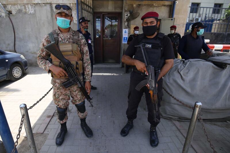 epa08517223 Pakistani security officials secure the Pakistan Stock Exchange (PSX) a day after terrorists attacked the building, in Karachi, Pakistan, 30 June 2020. At least nine people, including four attackers, were killed after insurgents belonging to Baloch Liberation Army (BLA) attacked PSX.  EPA/SHAHZAIB AKBER