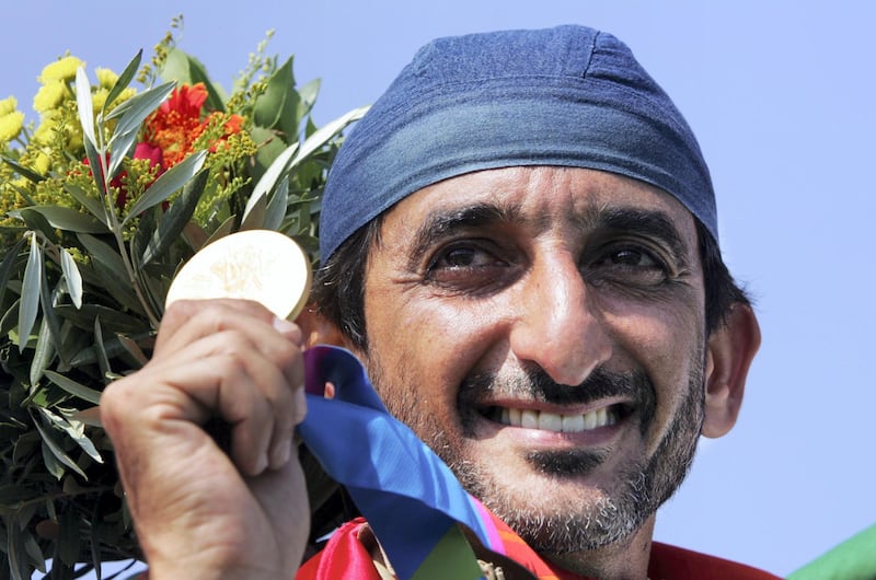 Sheikh Ahmed Al-Makoum of United Arab Emirates displays his medal after he won the men's double trap final in Athens.  Sheikh Ahmed Al-Makoum of United Arab Emirates displays his medal after he won the men's double trap final of the Athens 2004 Olympic Games in Athens, August 17, 2004. Almakyoum took gold with a score of 189. REUTERS/Guang Niu