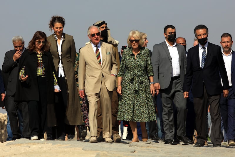 Prince Charles and Camilla pose for a photo as they visit the ancient Roman Decapolis city of Gadara, Umm Qais, 110km north of Amman. EPA