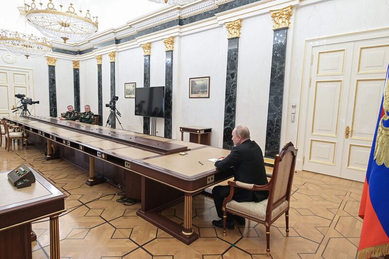 Russian President Vladimir Putin meets Defence Minister Sergei Shoigu, second from left, and chief of the general staff Valery Gerasimov to put the country’s nuclear ‘deterrence forces’ on high alert. AFP