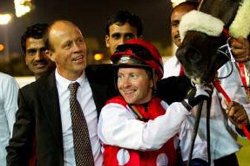 Trainer Ernst Oertel, left, has found a winning combination with jockey Tadhg O'Shea. Both are making runs to win the respective UAE titles in their profession.