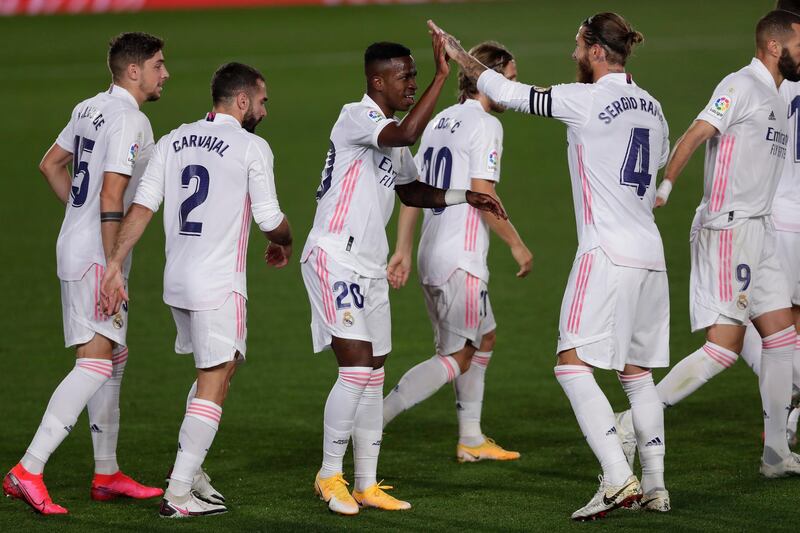 Real Madrid's Vinicius Junior, centre, celebrates with his teammates. AP