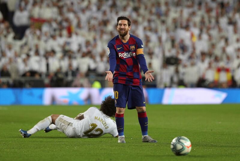 Barcelona's Lionel Messi reacts after fouling Real Madrid defender Marcelo. EPA