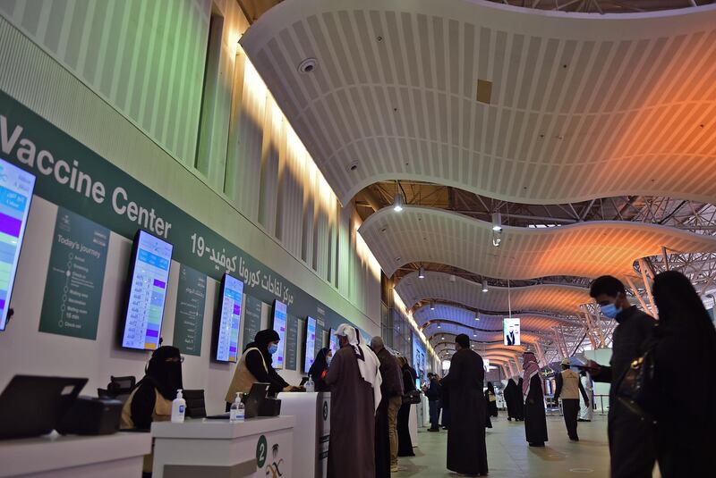 People register for vaccination at the Riyadh International Convention and Exhibition Centre, before receiving a dose of the Covid-19 vaccine in the Saudi Arabian capital Riyadh.  AFP