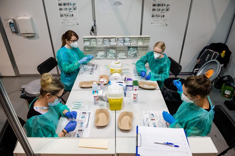 Medical Staff prepare vials of the Pfizer/BioNTech vaccine at a vaccination center at the Messe trade fair grounds in Erfurt, Germany. Getty Images