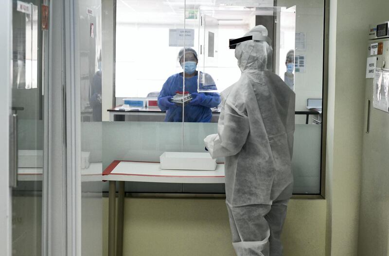 Abu Dhabi, United Arab Emirates - Lab technician carries out tests for Covid-19 detection at MenaLabs Medical Laboratory in Abu Dhabi. Khushnum Bhandari for The National
