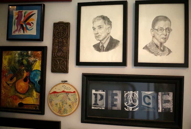 Sketches of political activist Ralph Nader and Ginsburg hang on a wall of Alison Dreith's home in southern Illinois. AP