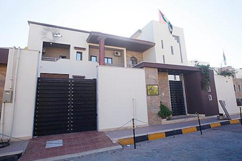 A view of the United Arab Emirates embassy after it was attacked in the Libyan capital of Tripoli July 25, 2013. The embassy was attacked on Thursday morning, with no injuries reported, Interior Ministry spokesman Rami Kaal said. REUTERS/Ismail Zitouny (LIBYA - Tags: POLITICS CIVIL UNREST)