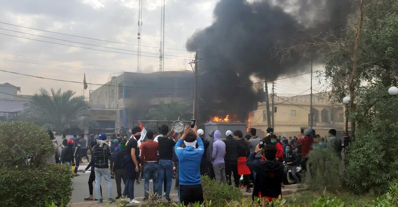 Smoke rises from the office of the Shiite endowment after it was set on fire by protesters during ongoing anti-government protests in Nassiriya, Iraq. Reuters