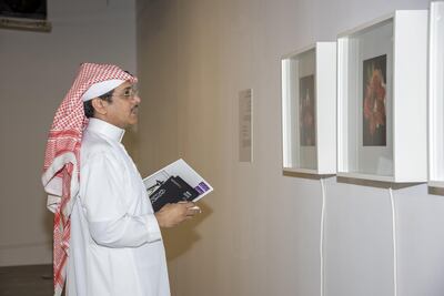 A visitor to We Are Not Alone curated by Contemporary Collective at Athr Gallery, Jeddah, Saudi Arabia. Pedro Masour