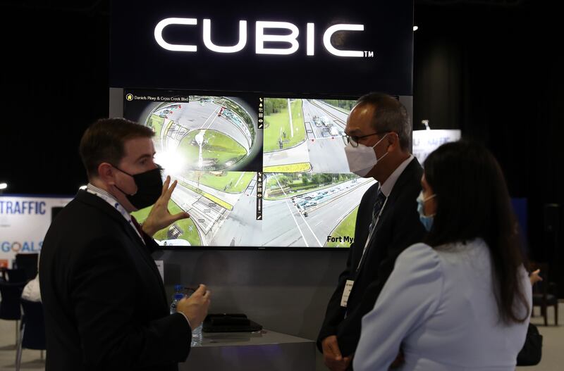 People visit the Cubic stand at Gulf Traffic.