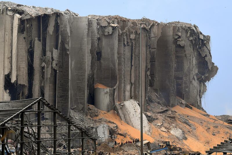 A picture taken on August 7, 2020, shows a view of destroyed grain silos in the port of Beirut, the site of a massive blast which shook the Lebanese capital. - Three days after the monster explosion that disfigured the city in a matter of seconds, the clock was already ticking down on any potential survivors' chances, as rescuers from Lebanon, France, Germany, Russia and other countries worked shifts to try to find an entrance to a control room buried under metres (yards) of rubble. (Photo by - / AFP)