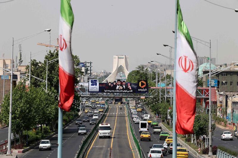 A view shows traffic on Azadi street in Iran's capital Tehran on April 20, 2021. / AFP / ATTA KENARE
