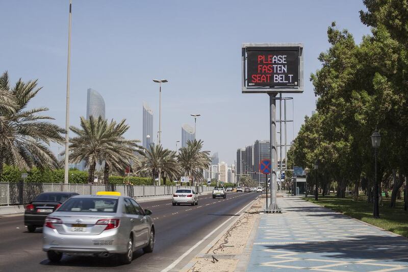 Abu Dhabi, United Arab Emirates. September 23, 2015///New 'Please fasten seat belt' sign on the Chorniche. Traffic safety. Abu Dhabi, United Arab Emirates. Mona Al Marzooqi/ The National Section: National 