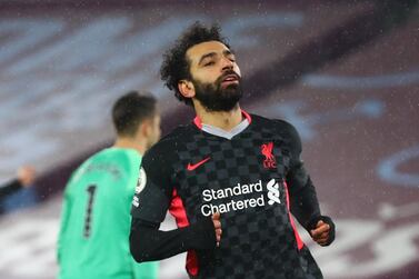 Soccer Football - Premier League - West Ham United v Liverpool - London Stadium, London, Britain - January 31, 2021 Liverpool's Mohamed Salah celebrates scoring their second goal Pool via REUTERS/Clive Rose EDITORIAL USE ONLY. No use with unauthorized audio, video, data, fixture lists, club/league logos or 'live' services. Online in-match use limited to 75 images, no video emulation. No use in betting, games or single club /league/player publications. Please contact your account representative for further details.