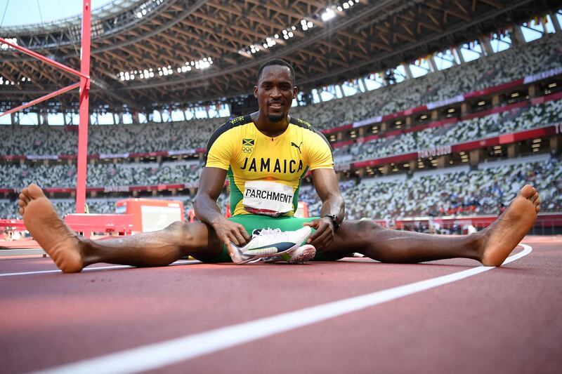 Jamaica's Hansle Parchment poses after winning  the men's 110m hurdles final during the Tokyo 2020 Olympic Games at the Olympic stadium in Tokyo.
