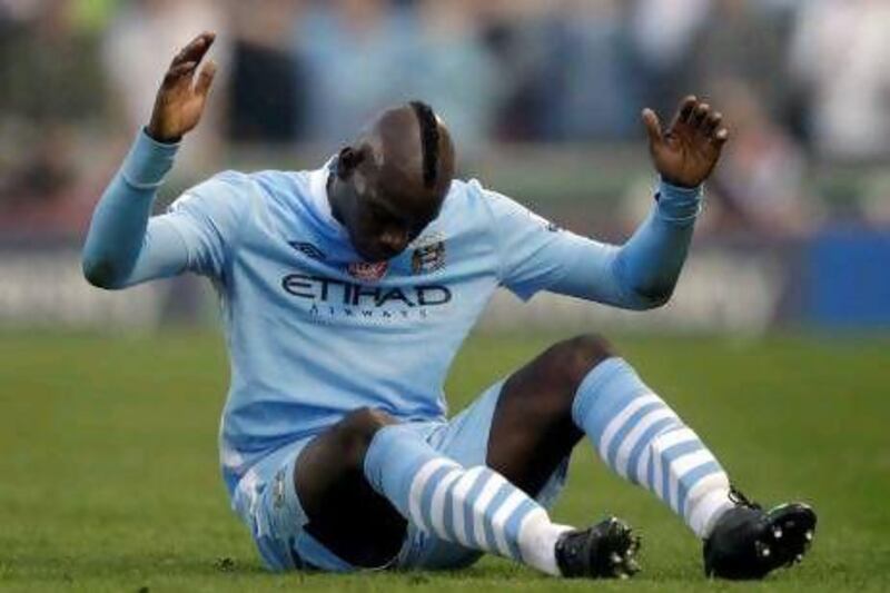 Manchester City's Mario Balotelli reacts in frustration after City were held at Stoke.