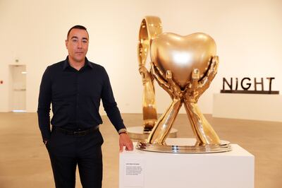 Lorenzo Quinn with one of his works at the Leila Heller Gallery at Alserkal Avenue in Dubai. Pawan Singh / The National