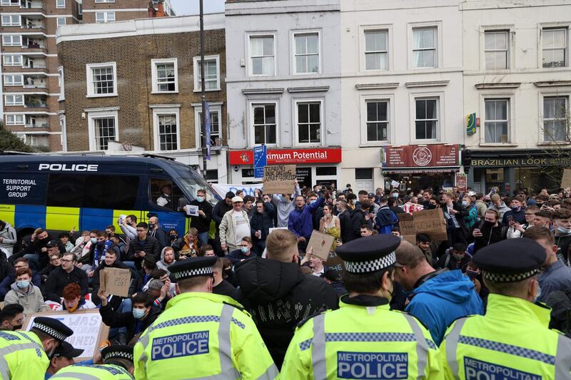 Football supporters demonstrate against the proposed European Super League outside Stamford Bridge. AFP