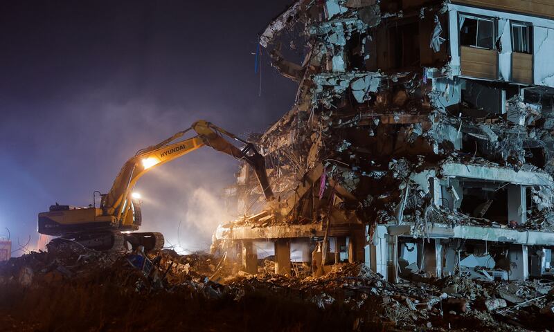 A damaged building being demolished in Hatay, in Turkey. Reuters