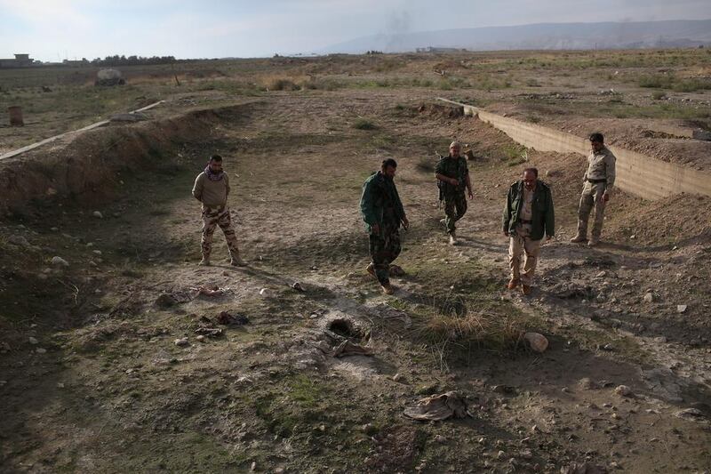 Kurdish forces say they have found a mass grave of more than 50 Yazidis killed by ISIL in Sinjar. John Moore / Getty Images