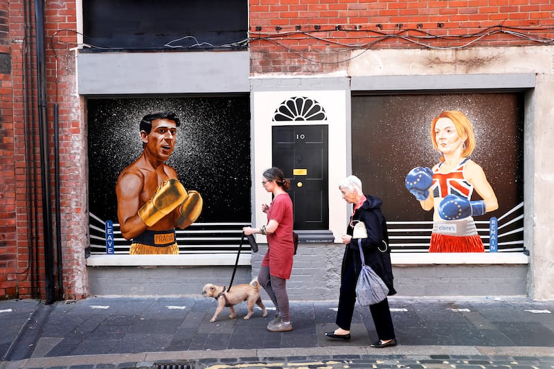 A mural showing the two leadership contestants appears on a wall in Belfast, Northern Ireland. AP