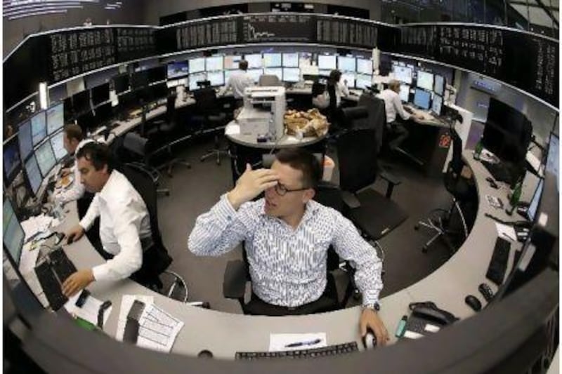 A trader reacts at his desk at the Frankfurt stock exchange yesterday as European shares extended the previous session's sharp sell-off on Friday. Reuters