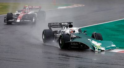 Pierre Gasly's car hits some boarding prior to the near miss with a recovery vehicle. Reuters