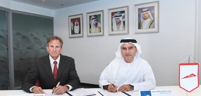 Abdul Younes, right, CEO of RTA's rail agency, signed a Memorandum of Understanding with John Cole, CEO of skyTran. Courtesy RTA    