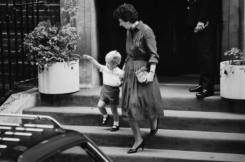 1984: Prince William leaves the Lindo Wing of St Mary's Hospital in London holding the hand of his nanny Barbara Barnes, having visiting his mother Princess Diana, after the birth of his brother Prince Harry. Getty Images