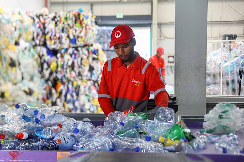 An employee sorts recyclable plastics at a warehouse and sorting facility, in Dubai, on March 7. Reuters