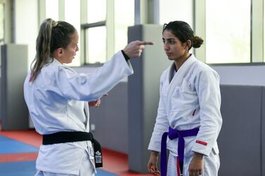 Shamma Al Kalbani trains with her coach Polyana Lago, at the Jiu Jitsu Arena, Zayed Sports City in Abu Dhabi. Khushnum Bhandari / The National
