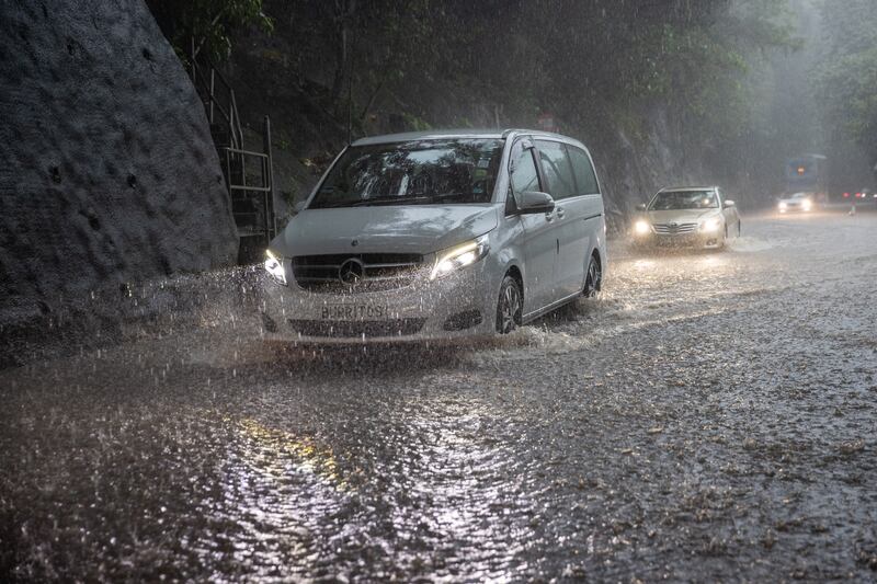 The Hong Kong Observatory briefly upgraded its rainstorm warning to black, the highest level, amid torrential downpours brought by Typhoon Lionrock. EPA